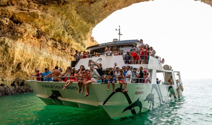 From Portimão: Catamaran Cruise to Benagil Caves with BBQ - Entering the Benagil caves by small boat