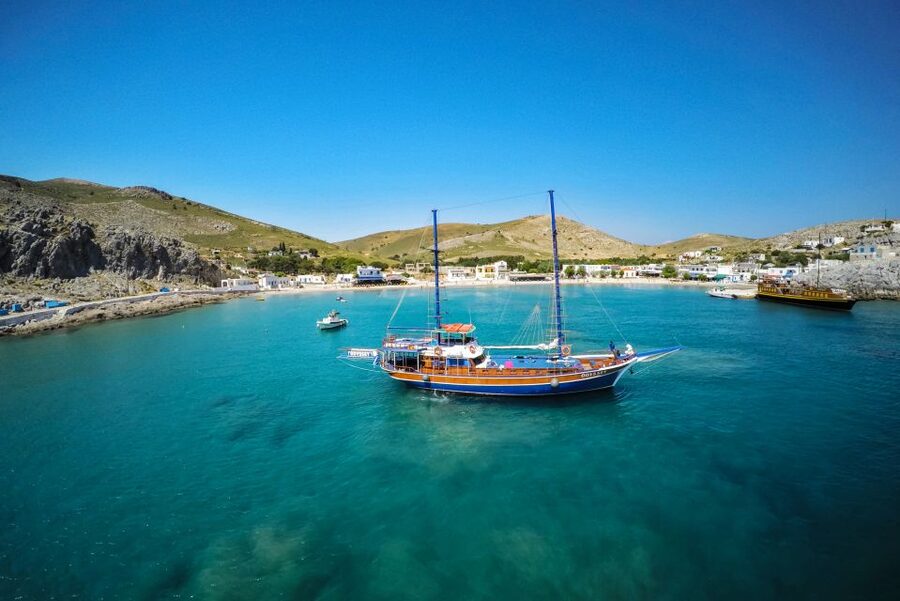 From the Port of Kos: Full Day Boat Cruise to 3 Islands - The Odyssey atmosphere: relaxed, friendly, and not perfectly quiet