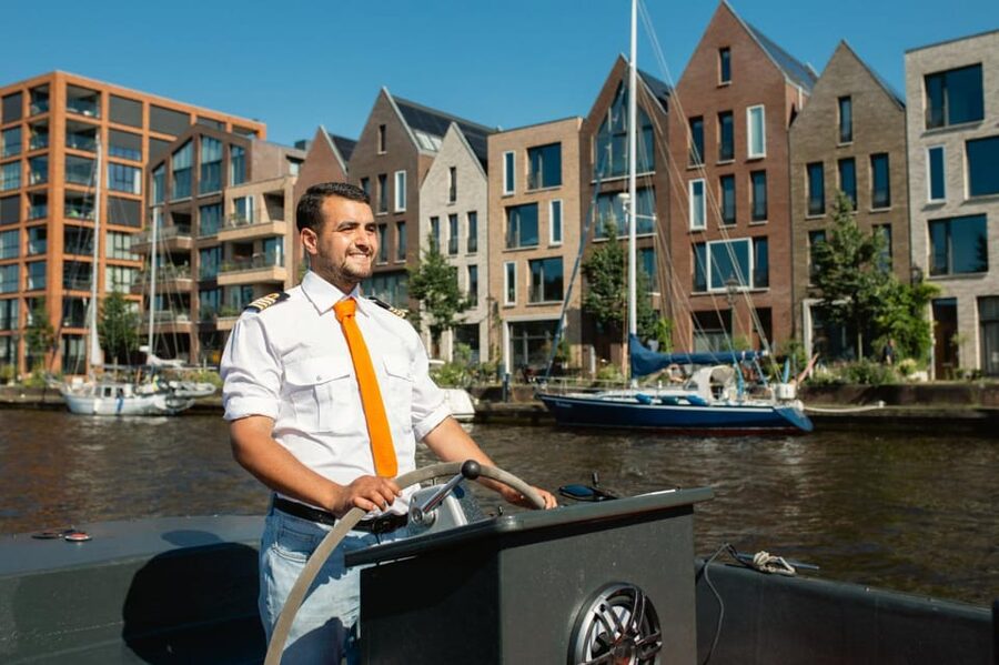 Haarlem: Sightseeing Boat Tour with Snacks and Drinks - Molen de Adriaan from canal level