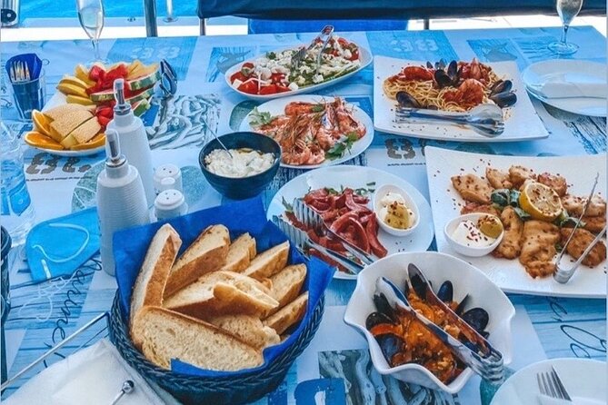 Half-Day Exclusive Catamaran Cruise in Santorini with Meal and Open Bar - Swimming by Santorini Volcano and the hot springs
