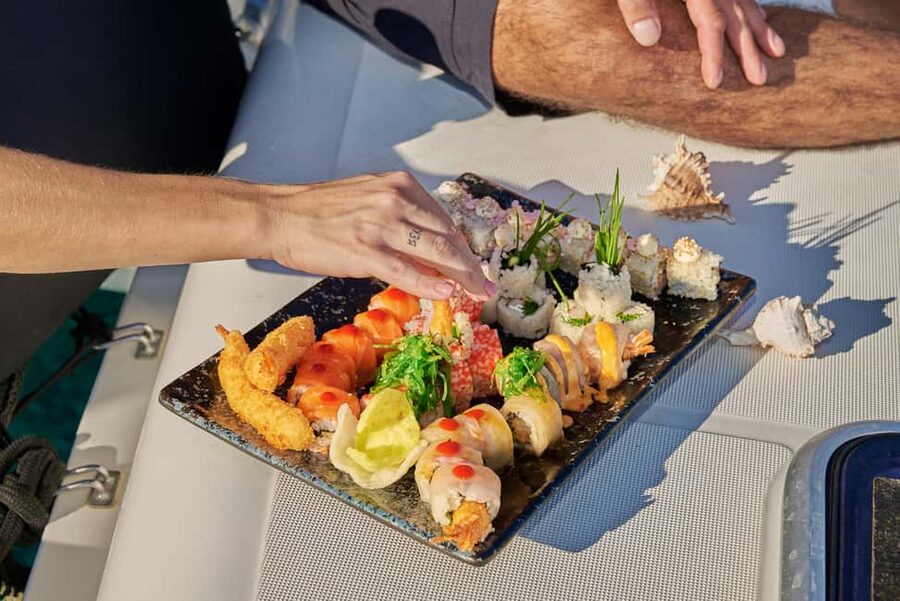 Hersonissos: Luxury Sunset Catamaran Cruise Sushi & Open Bar - Saint George Bay, the swimming stop, and the chapel above the water
