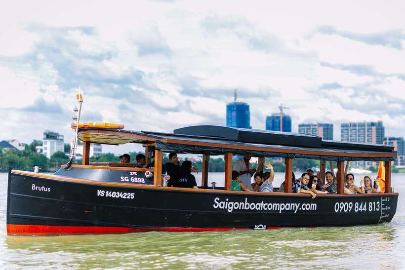 Ho Chi Minh City: Saigon River Boutique Cruise - Flags, civic buildings, and the city center