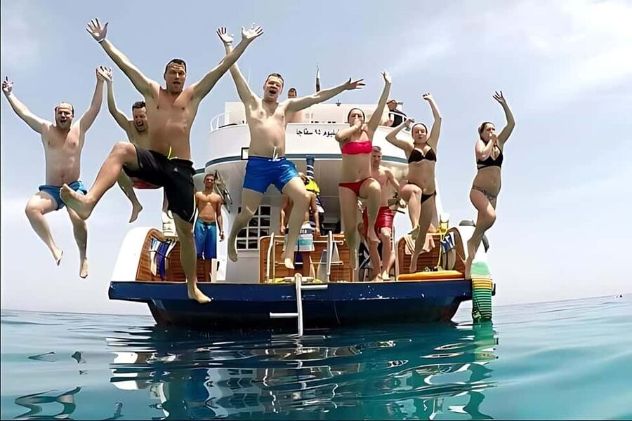 Hurghada: Dolphin Watching Boat Tour with Snorkeling & Lunch - Banana boat rides and the final burst of fun