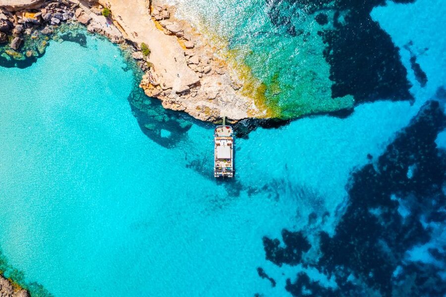 Ibiza: Beach Hopping Cruise w/ Paddleboard, Food, & Drinks - Cala Bassa brings the first beach reward