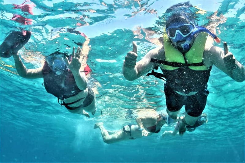 Ibiza: Snorkeling, Sunset Beach and Cave Boat Trip - Cala Comte: clear water and paddleboarding