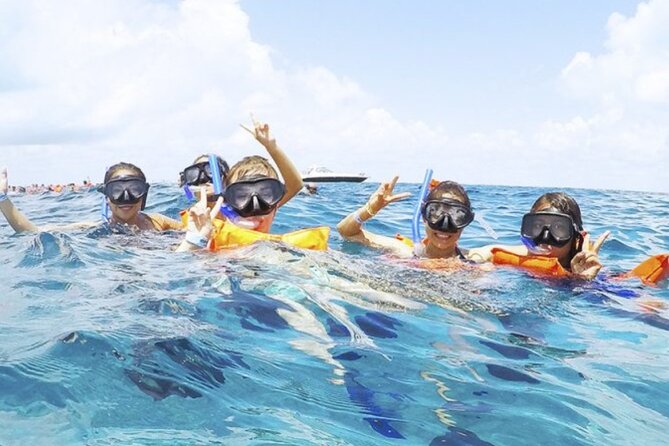 Isla Mujeres Catamaran Tour with Snorkel, Open bar and Transport - A party cruise with a reef stop