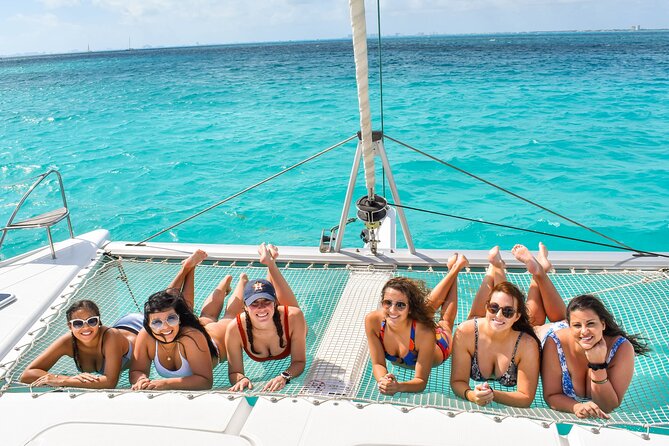 Isla Mujeres Catamaran Tour with Snorkel, Open bar and Transport - Weather, cancellations, and practical limits