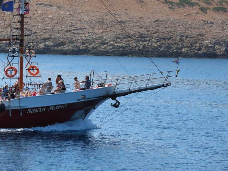 Kos: 3-Island Cruise with Lunch, Swimming and Audio Guide - Leaving Kos and watching for dolphins