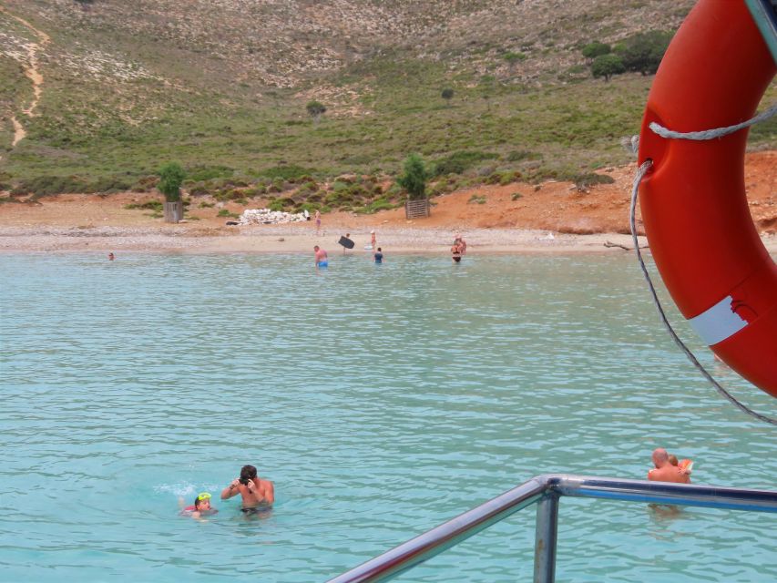 Kos Town: Glass-Bottom Boat Cruise with Swimming Stops - Looking through the glass-bottom sections