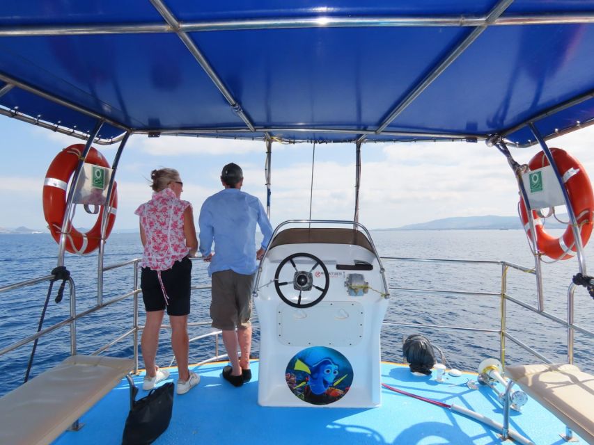 Kos Town: Glass-Bottom Boat Cruise with Swimming Stops - Seating, shade, music, and onboard comfort