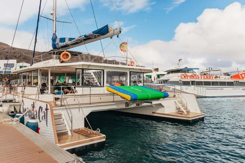 La Graciosa: Island Cruise with Lunch and Water Activities - Boarding the Catamaran With a Welcome Mojito
