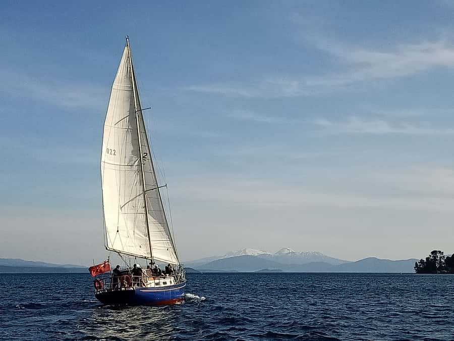 Lake Taupo: Classical Sailing to the Māori Rock Carvings - Arriving at Mine Bay and the 14-metre carving