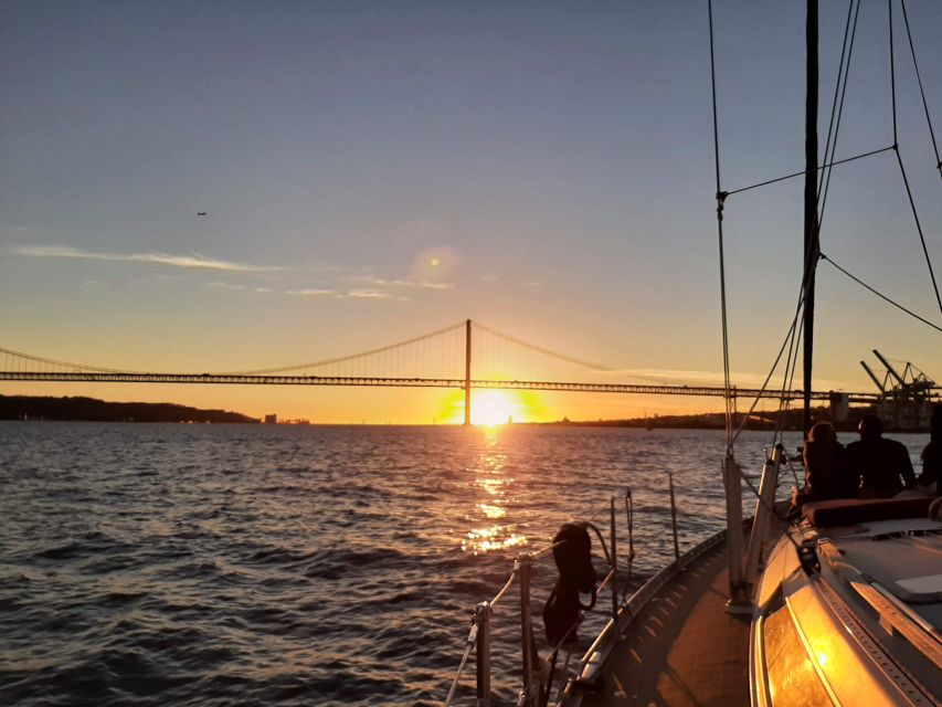 Lisbon: City Skyline Sailboat Cruise with Drink and Snacks - Under the 25 de Abril Bridge toward Belém