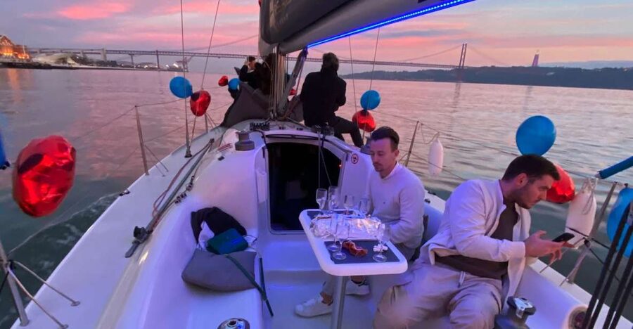 Lisbon: Sailboat Tour w/ Local Guide and Open Bar Green Wine - Setting out beneath the 25 de Abril Bridge
