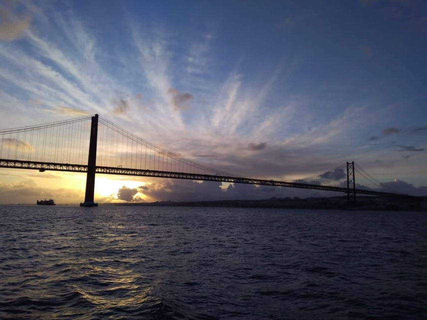 Lisbon: Sunset Cruise With Drinks on Spacious Yacht - Turning beneath the 25 de Abril Bridge