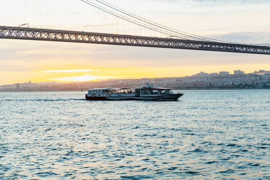 Lisbon: Sunset Cruise with Welcome Drink and Snacks - Passing under the 25 April Bridge