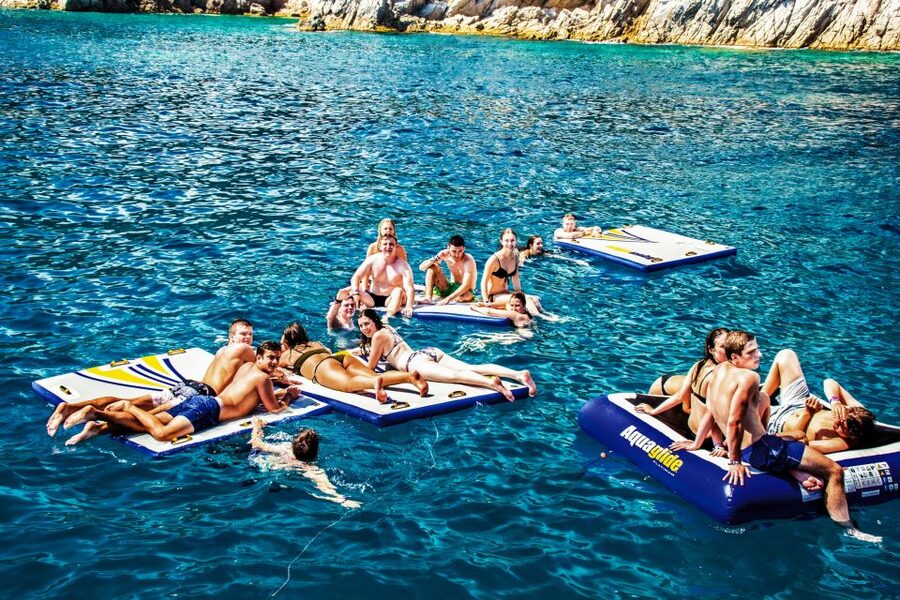 Lloret de Mar: Catamaran Sailing Cruise with BBQ and Drinks - Sailing out from Lloret de Mar’s beach promenade