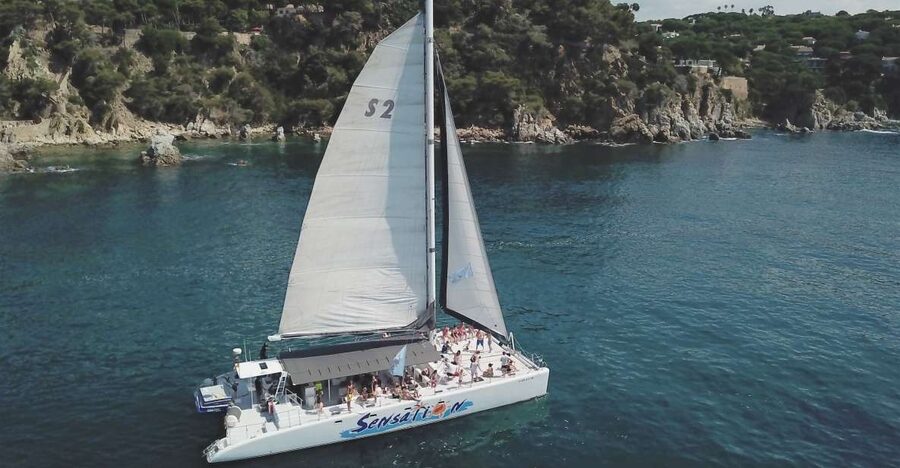 Lloret de Mar: Sunset Catamaran Cruise with DJ and Drinks - Setting sail from Lloret de Mar