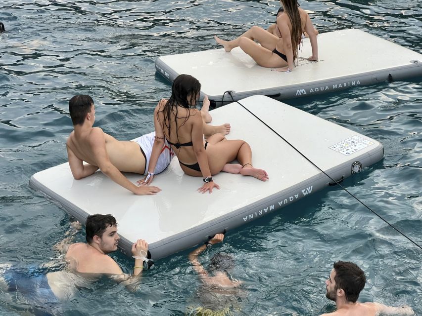 Lloret de Mar: Sunset Catamaran Cruise with DJ and Drinks - The quiet inlet and swimming stop