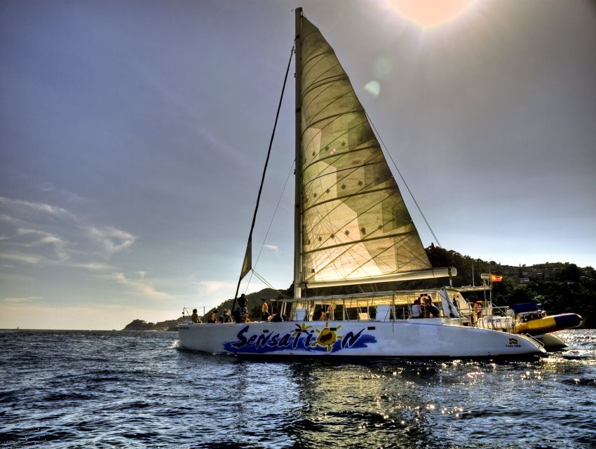 Lloret de Mar: Sunset Catamaran Cruise with DJ and Drinks - Two hours along the Costa Brava shore