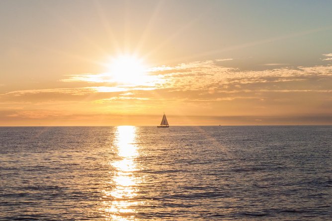 Los Cabos Luxury Sunset Sail with Light Appetizers and Open Bar - Pickup, marina arrival, and the fees that matter