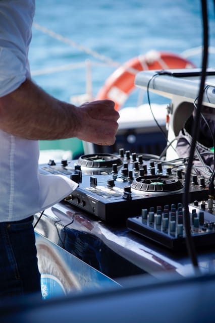 Malaga: Catamaran Sailing Cruise with Swimming & Optional DJ - Choosing the DJ option