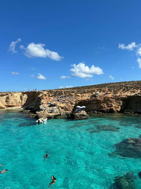 Malta: Gozo, Comino & Blue Lagoon Cruise - swim & sightsee - Pineapple cocktails, shade, and practical comfort