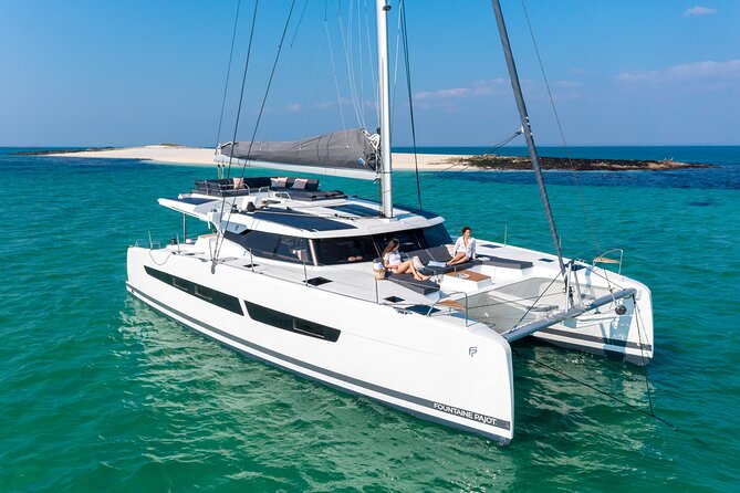 Mykonos: Brand-New Catamaran Cruise with Meal, Drinks & Transport - Rhenia, clear water, and a useful change of scene