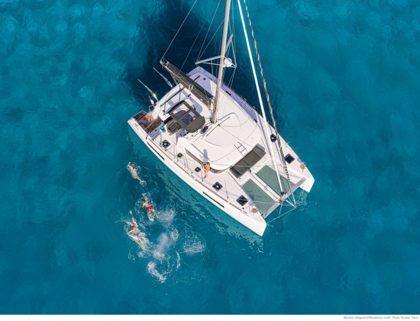 Mykonos: Catamaran Cruise with Lunch, Drinks and Transfer - Passing Delos without going ashore