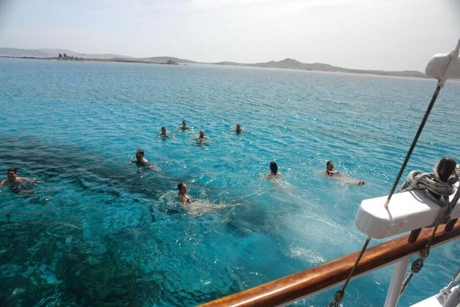 Mykonos: Sunset Party Boat Cruise with 1 Drink - Agios Stefanos gives you a proper swim stop
