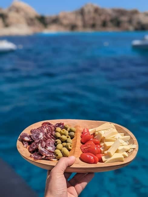 Olbia: Dolphin Watching & Snorkeling Boat Trip - Swimming and snorkeling at Cala Moresca