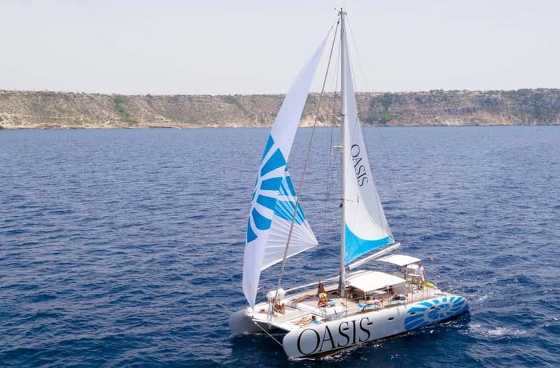 Palma de Mallorca: Deluxe Catamaran Sailing Tour with Meal - Leaving Palma and heading toward Cala Vella
