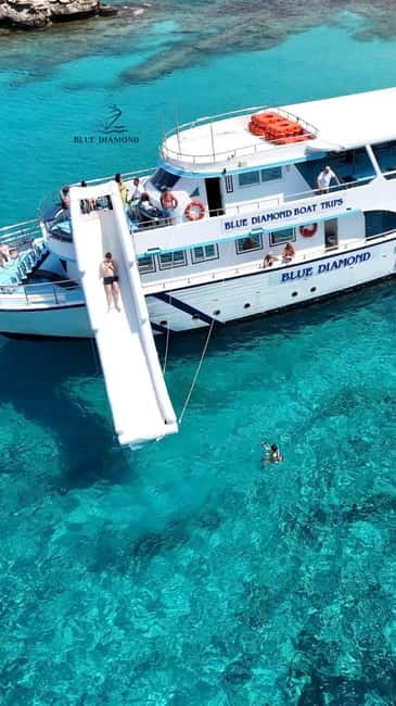 Paphos Blue Lagoon Cruise: Slide, Music & Hotel Transfer - Boarding the three-hour cruise