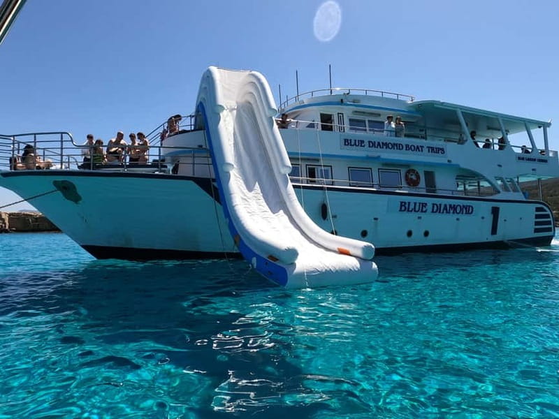 Paphos Blue Lagoon Cruise: Slide, Music & Hotel Transfer - Drinks, fruit, and food onboard