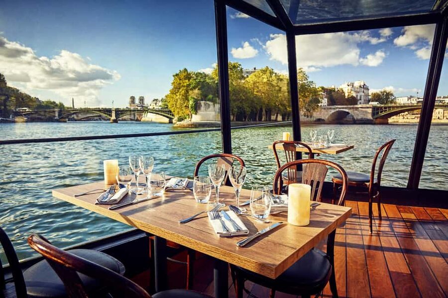 Paris: 3-Course Lunch Cruise on the River Seine - Settling into the glass-enclosed boat