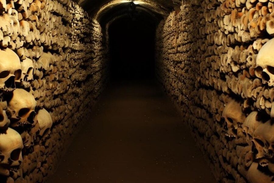 Paris: Catacombs, Audio Guide, and River Cruise Option - Descending 130 steps into the tunnels