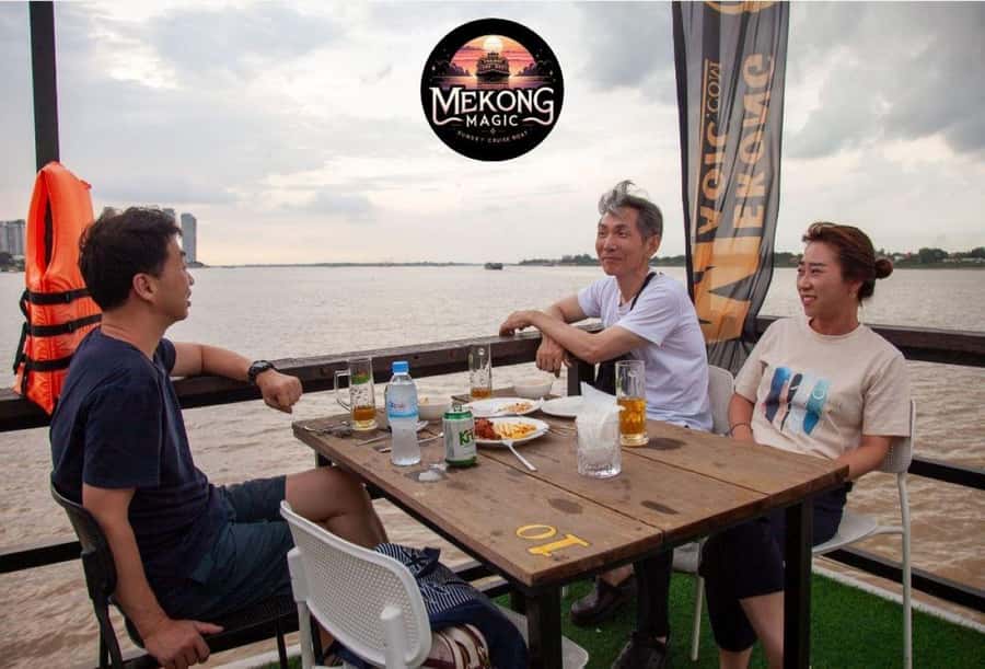 Phnom Penh: Sunset Cruise with Unlimited Beers & BBQ Buffet - Diamond Island Bridge and the Cambodian Flag