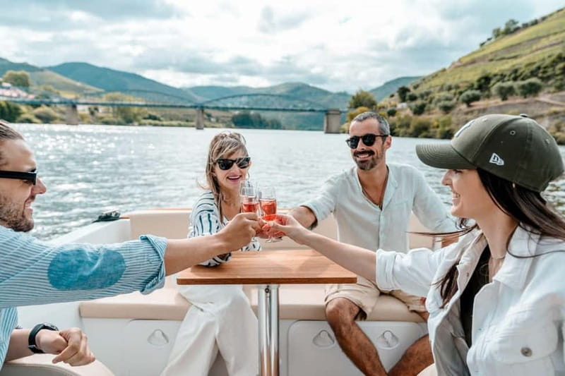 Pinhão: Douro River Solar Boat Tour with Wine Tasting - Two Adega de Favaios wines, plus grape juice