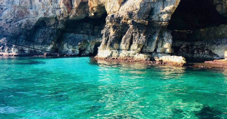 Polignano a Mare: Boat Trip, Swim & Cave with Aperitif - Polignano’s cliffside landmarks from the water
