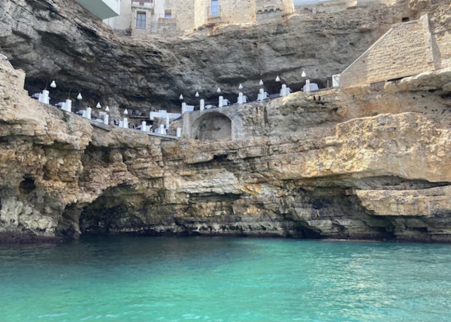 Polignano's coast and caves: a boat tour with drinks, swimming, music, and fun - Key points at a glance