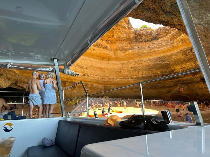 Portimão: Benagil Caves & Golden Coast Eco Catamaran Tour - Entering Benagil Cave and the smaller coastal caves