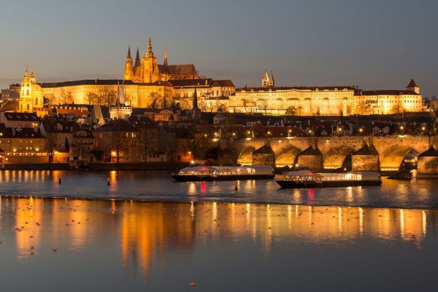 Prague: City Tour and Dinner Cruise with Hotel Pickup - Boarding the Vltava boat for a three-hour dinner