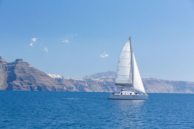 Premium Small-Group Catamaran Cruise with BBQ, Open Bar, Transfer - Thirasia and the quieter final cove