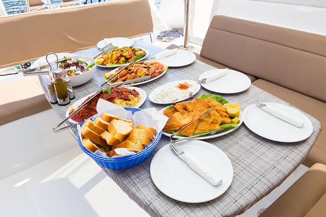 Premium Small-Group Catamaran Cruise with BBQ, Open Bar, Transfer - Pickup, group size, and the real time commitment