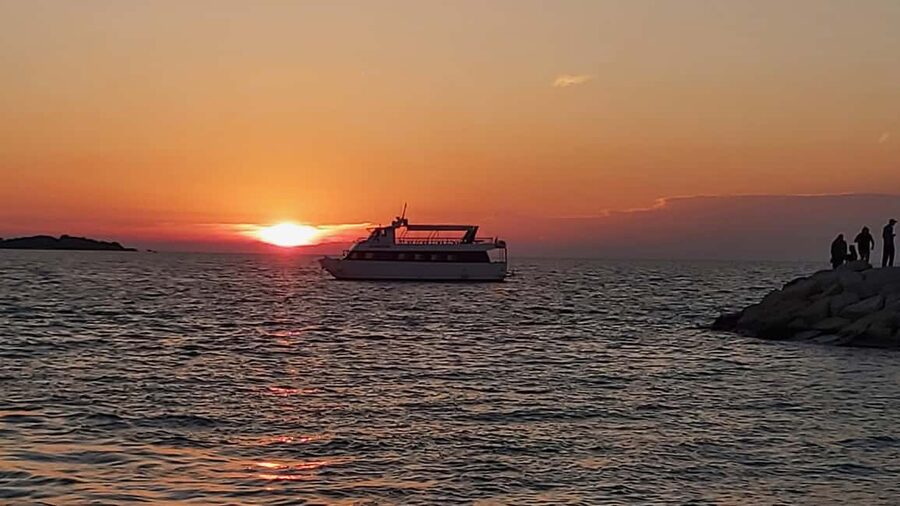 Pula: Dolphin Sunset Cruise to Brijuni with Dinner & Drinks - Sunset views from the open deck