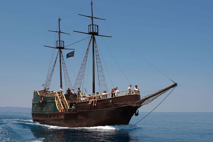 Rethymno: Pirate Boat Cruise with Swimming Stop - Returning past the caves and Venetian harbor