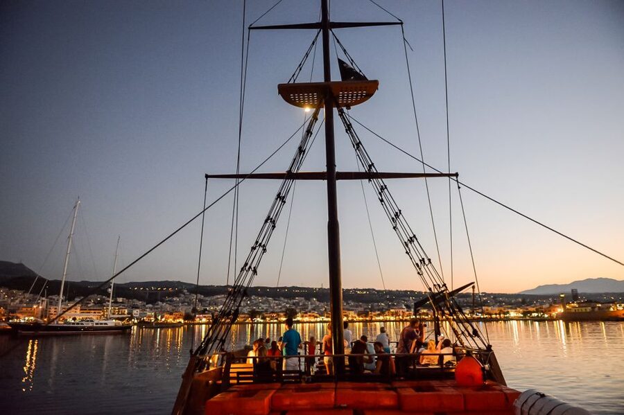 Rethymno: Sunset Cruise on a Wooden Pirate Boat - Sunset beyond the harbor