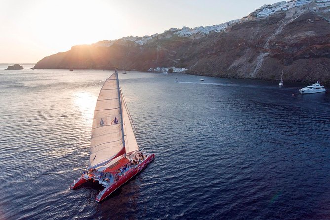 Sailing Catamaran Cruise in Santorini with BBQ, Drinks and Transfer - White Beach, the longest stop and lunch aboard