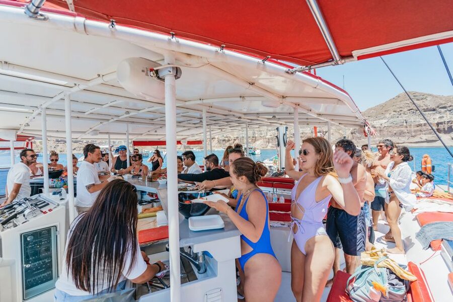 Santorini: Catamaran Tour with BBQ Dinner, Drinks, and Music - Who should book this catamaran cruise?