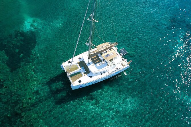 Santorini Classic Catamaran Cruise with BBQ, Drinks and Transfers - Daytime sailing or sunset cruise